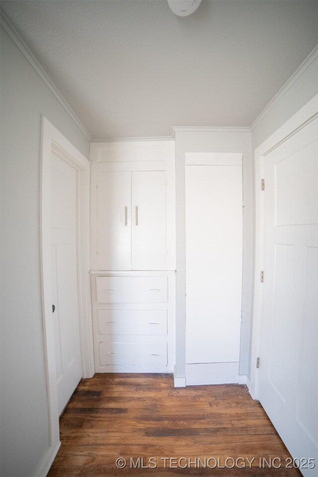 2705 E Ute St, Tulsa, OK 74110 - unfurnished bedroom featuring wood finished floors, crown molding, and a closet