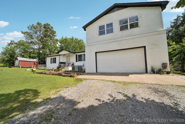 36516 Cramer Rd N, Mannford, OK 74044 - traditional-style home featuring dirt driveway, brick siding, a front lawn, and an attached garage