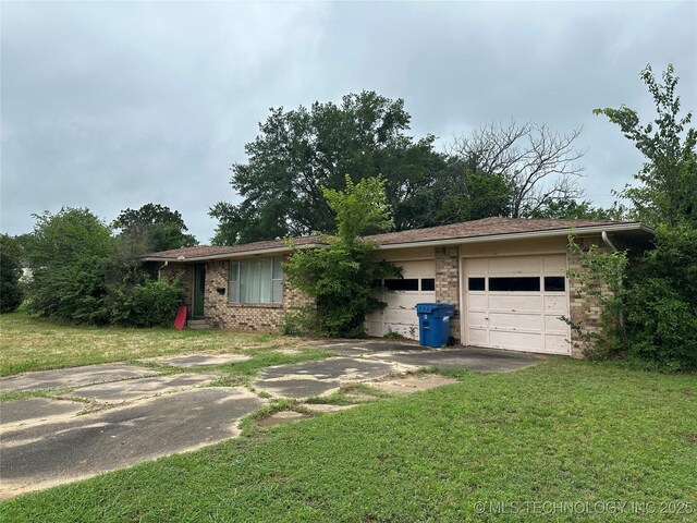1581 S Velma, Atoka, OK 74525 - ranch-style home with a garage, brick siding, a front lawn, and driveway