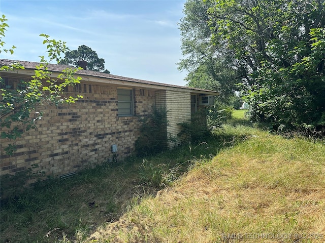 1581 S Velma, Atoka, OK 74525 - view of side of home with brick siding