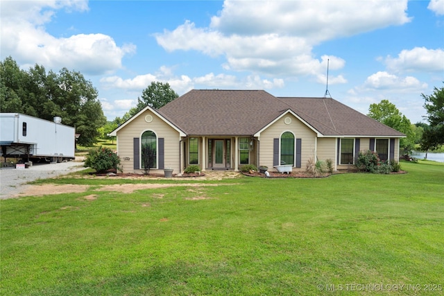 5764 S Carr, Pen, OK 74525 - view of front facade with a front yard and a shingled roof