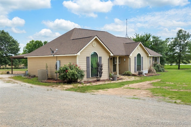 5764 S Carr, Pen, OK 74525 - view of front of home featuring driveway, a front lawn, and a shingled roof