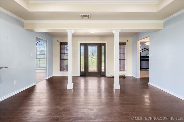 5764 S Carr, Pen, OK 74525 - entrance foyer with ornate columns, dark wood-style flooring, crown molding, and a raised ceiling