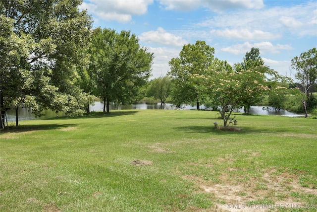 5764 S Carr, Pen, OK 74525 - view of green lawn featuring a water view