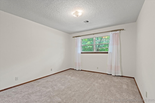 1020 Lariat Dr, Bartlesville, OK 74006 - carpeted spare room with a textured ceiling and baseboards