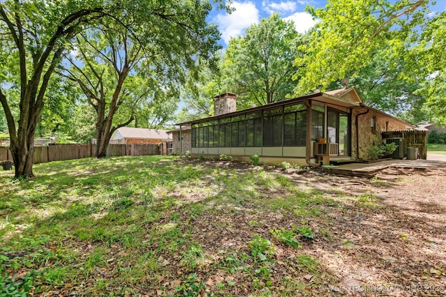 1020 Lariat Dr, Bartlesville, OK 74006 - view of yard with a sunroom