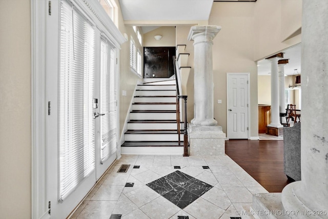 524 S 67th St, Broken Arrow, OK 74014 - stairway with decorative columns and tile patterned flooring