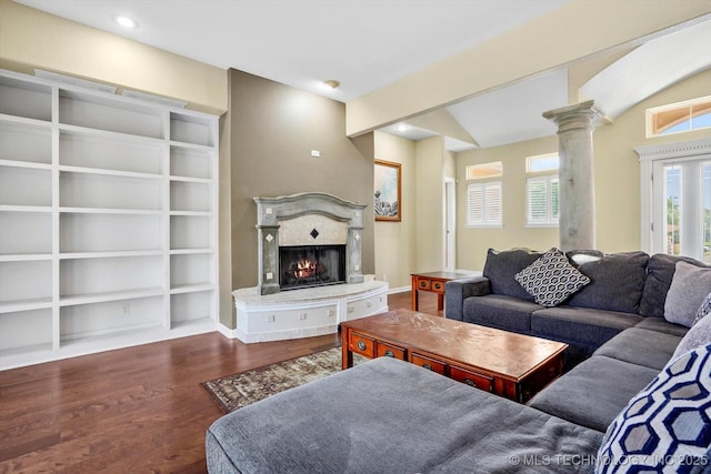 524 S 67th St, Broken Arrow, OK 74014 - living area with wood finished floors, ornate columns, a lit fireplace, and recessed lighting