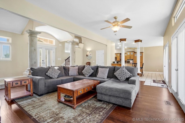 524 S 67th St, Broken Arrow, OK 74014 - living room with ornate columns, ceiling fan, wood finished floors, lofted ceiling, and stairs