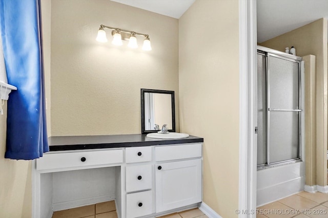 524 S 67th St, Broken Arrow, OK 74014 - bathroom featuring tile patterned floors, vanity, and combined bath / shower with glass door