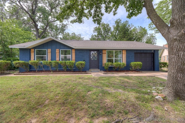 13306 E 28th St, Tulsa, OK 74134 - view of front of property featuring a garage, brick siding, a front lawn, and concrete driveway