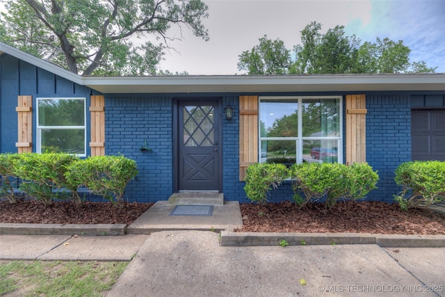 13306 E 28th St, Tulsa, OK 74134 - view of exterior entry featuring brick siding