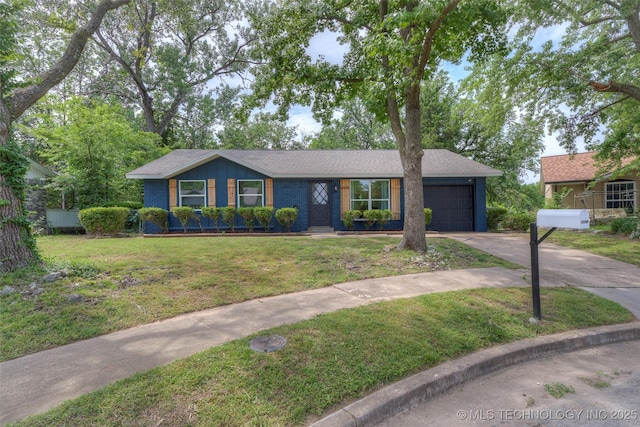 13306 E 28th St, Tulsa, OK 74134 - view of front of property with driveway, a garage, a front lawn, and brick siding