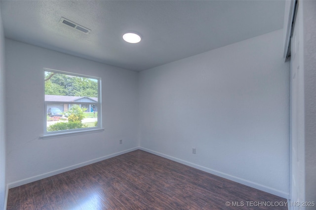 13306 E 28th St, Tulsa, OK 74134 - empty room with dark wood finished floors and baseboards