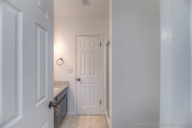 13306 E 28th St, Tulsa, OK 74134 - bathroom featuring tile patterned floors, vanity, and a shower stall