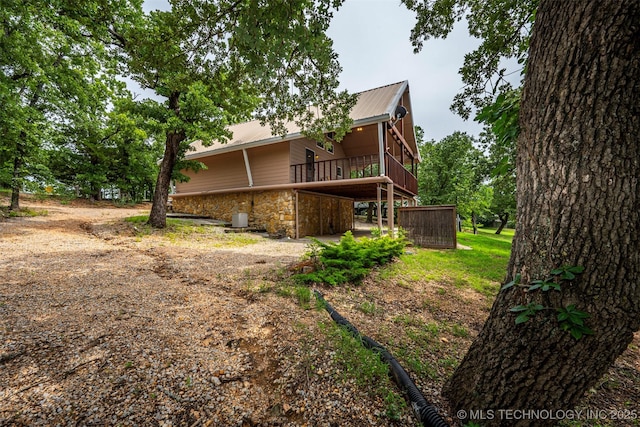 2676 Masters, Sulphur, OK 73086 - rear view of house featuring a metal roof and stone siding