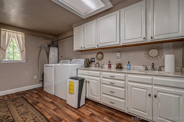 2676 Masters, Sulphur, OK 73086 - laundry area with cabinet space, washing machine and dryer, and dark wood-style flooring