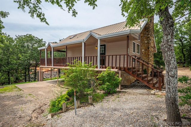 2676 Masters, Sulphur, OK 73086 - view of front facade featuring driveway, a metal roof, and a porch