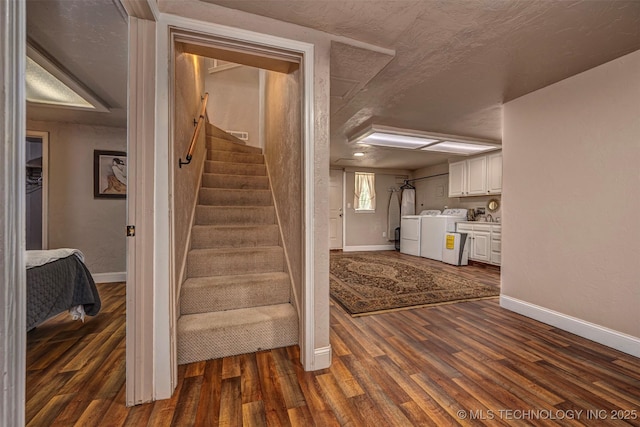 2676 Masters, Sulphur, OK 73086 - stairway featuring washing machine and clothes dryer, wood finished floors, and a textured ceiling