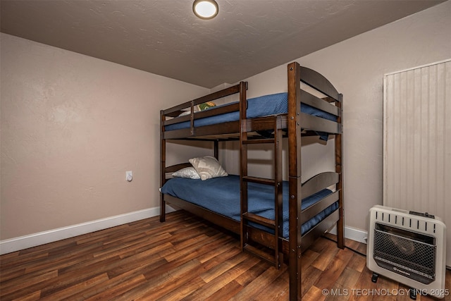 2676 Masters, Sulphur, OK 73086 - bedroom with heating unit and wood finished floors
