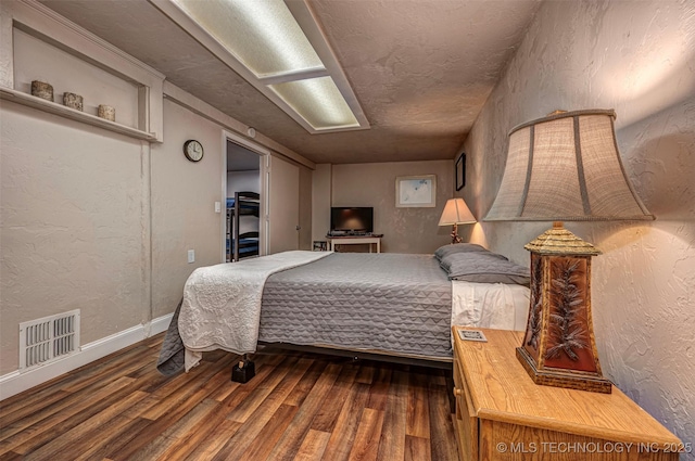 2676 Masters, Sulphur, OK 73086 - bedroom with dark wood-style floors, a textured wall, and a textured ceiling