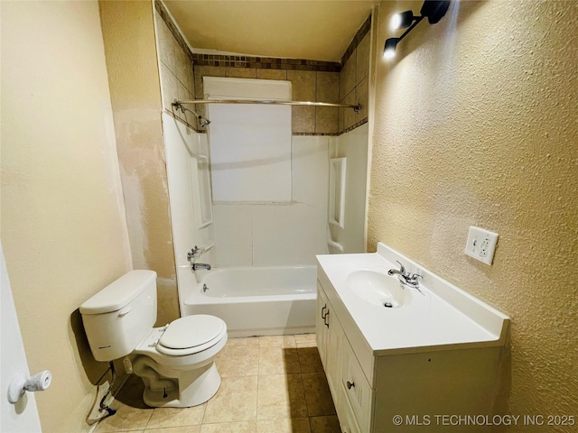 910 N Collins St, Okmulgee, OK 74447 - bathroom featuring a textured wall, vanity, tile patterned flooring, and shower / tub combination