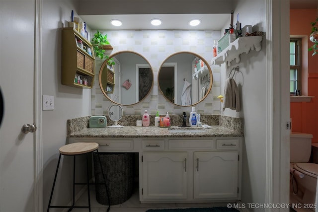 204 W Albuquerque St, Broken Arrow, OK 74011 - bathroom featuring vanity and recessed lighting