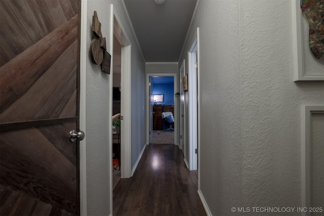 204 W Albuquerque St, Broken Arrow, OK 74011 - hallway with dark wood-style flooring, a textured wall, and ornamental molding