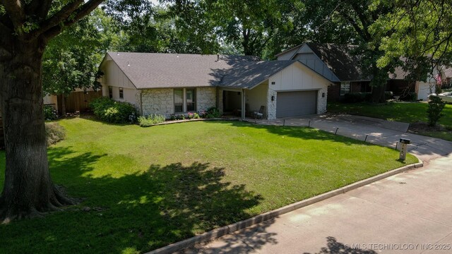 204 W Albuquerque St, Broken Arrow, OK 74011 - view of front facade featuring board and batten siding, a garage, driveway, and stone siding