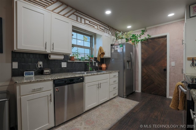 204 W Albuquerque St, Broken Arrow, OK 74011 - kitchen with appliances with stainless steel finishes, dark wood-style floors, white cabinetry, tasteful backsplash, and recessed lighting