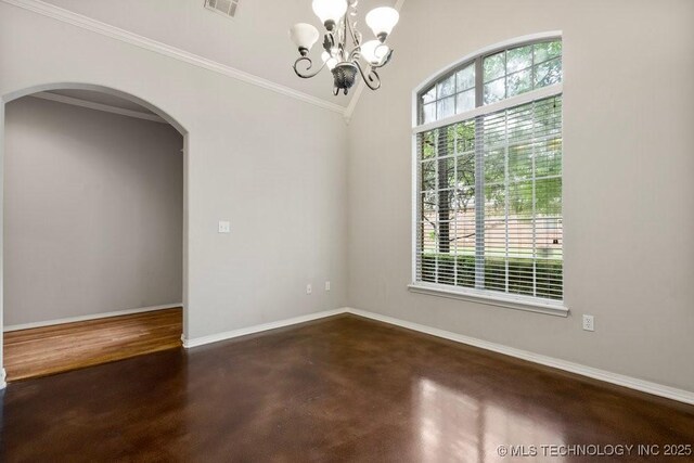 9929 S 85th E Ave, Tulsa, OK 74133 - empty room featuring arched walkways, a chandelier, crown molding, and concrete floors