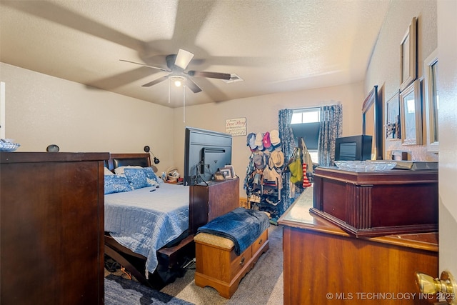 624 S Barclay, Dewey, OK 74029 - carpeted bedroom featuring a textured ceiling and ceiling fan