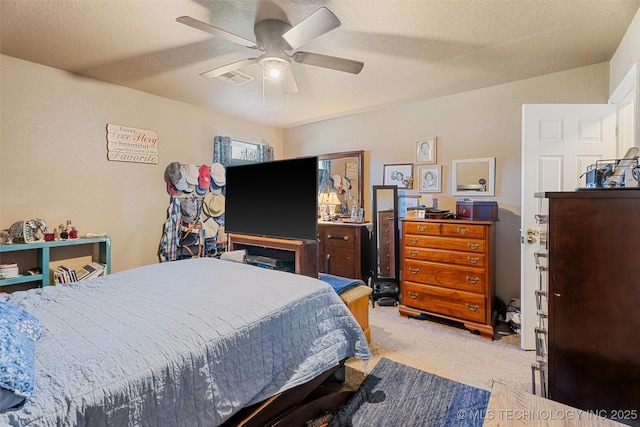 624 S Barclay, Dewey, OK 74029 - bedroom featuring carpet flooring, ceiling fan, and a textured ceiling