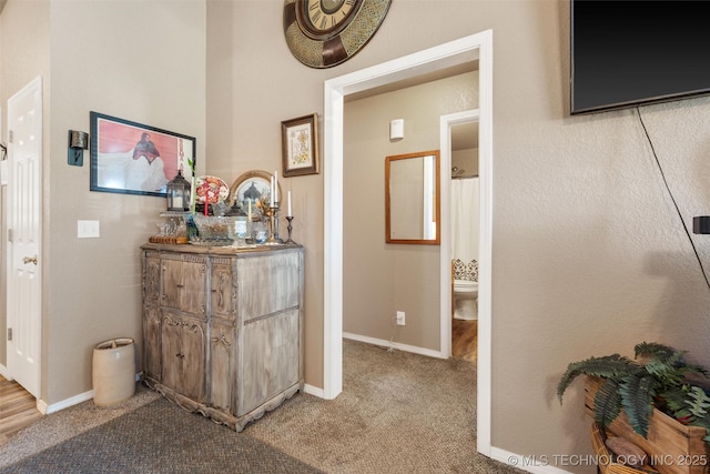 624 S Barclay, Dewey, OK 74029 - hallway featuring light colored carpet and baseboards