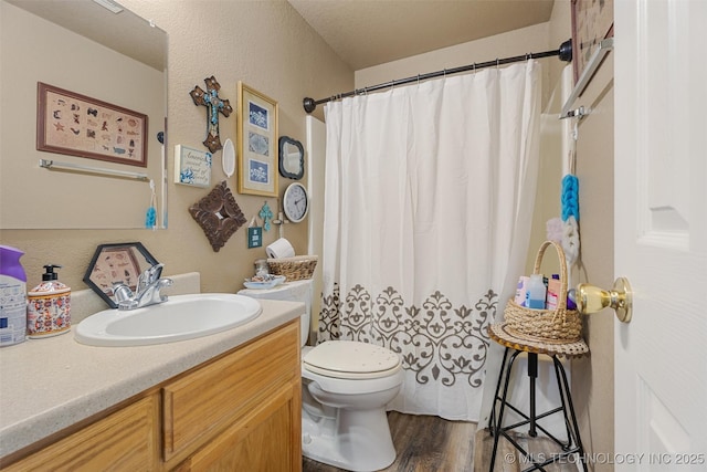624 S Barclay, Dewey, OK 74029 - bathroom featuring vanity, wood finished floors, and a shower with shower curtain