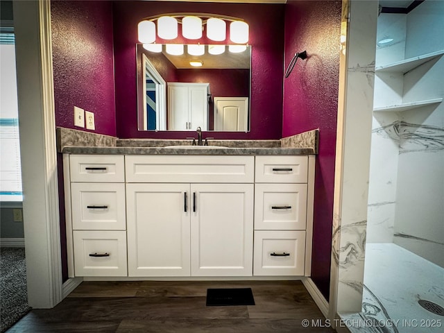 37103 S 4390th Rd, Adair, OK 74330 - bathroom featuring vanity, wood finished floors, and a textured wall