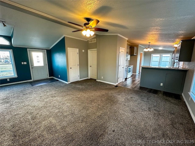 37103 S 4390th Rd, Adair, OK 74330 - unfurnished living room with dark colored carpet, a chandelier, a textured ceiling, crown molding, and lofted ceiling