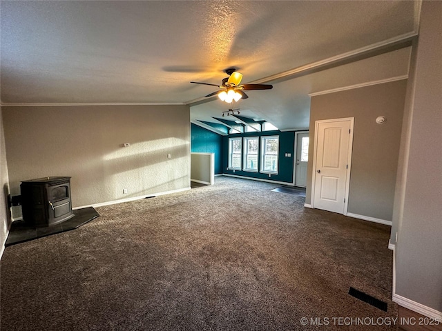 37103 S 4390th Rd, Adair, OK 74330 - unfurnished living room featuring a wood stove, a ceiling fan, carpet floors, lofted ceiling, and ornamental molding