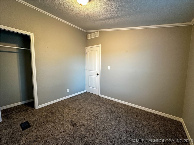 37103 S 4390th Rd, Adair, OK 74330 - unfurnished bedroom with a textured ceiling, ornamental molding, carpet floors, and a closet