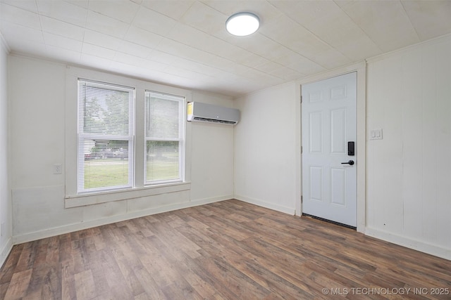 816 S Choctaw Ave, Bartlesville, OK 74003 - unfurnished room featuring a wall mounted AC, wood finished floors, and ornamental molding