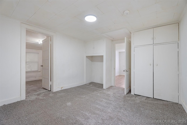 816 S Choctaw Ave, Bartlesville, OK 74003 - unfurnished bedroom featuring light carpet, connected bathroom, and a closet