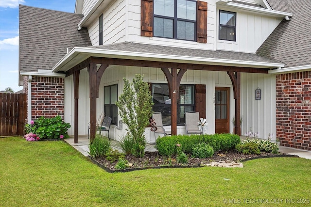 14271 S College Ave, Bixby, OK 74008 - view of exterior entry featuring brick siding, a shingled roof, and a porch