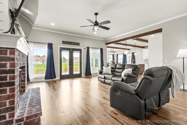 14271 S College Ave, Bixby, OK 74008 - living area featuring a fireplace, ceiling fan, recessed lighting, wood finished floors, and french doors