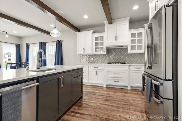 14271 S College Ave, Bixby, OK 74008 - kitchen with appliances with stainless steel finishes, beam ceiling, tasteful backsplash, light countertops, and white cabinetry