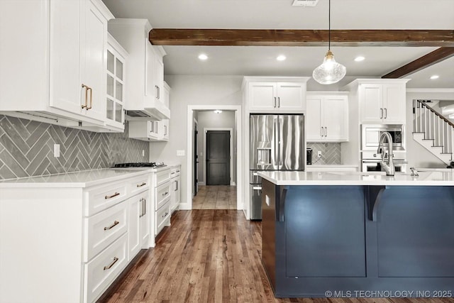 14271 S College Ave, Bixby, OK 74008 - kitchen featuring stainless steel appliances, beamed ceiling, tasteful backsplash, light countertops, and recessed lighting