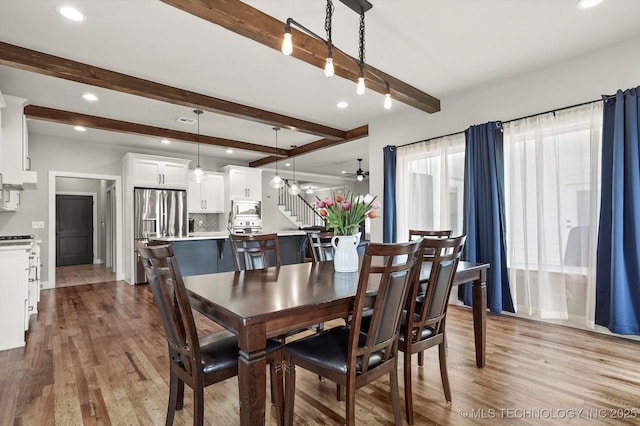 14271 S College Ave, Bixby, OK 74008 - dining space featuring beam ceiling, light wood-style flooring, recessed lighting, stairway, and a chandelier