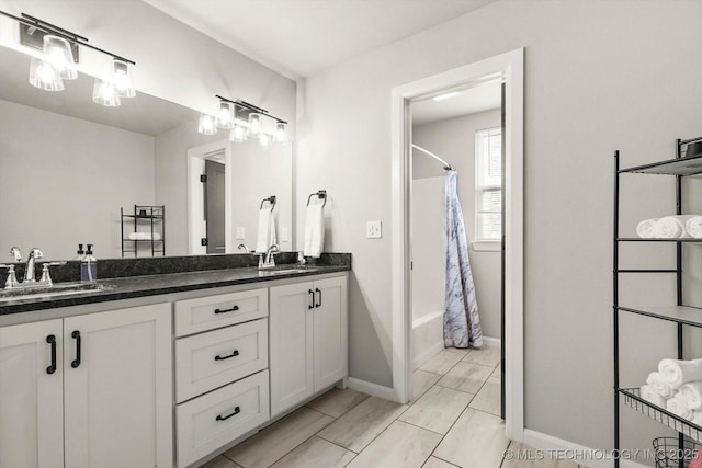 14271 S College Ave, Bixby, OK 74008 - bathroom featuring double vanity and shower / tub combo with curtain