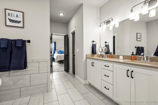 14271 S College Ave, Bixby, OK 74008 - bathroom featuring double vanity and ensuite bath