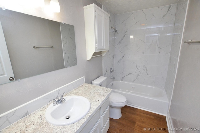 1107 Hillcrest Ave, Tahlequah, OK 74464 - bathroom featuring vanity, wood finished floors, and washtub / shower combination