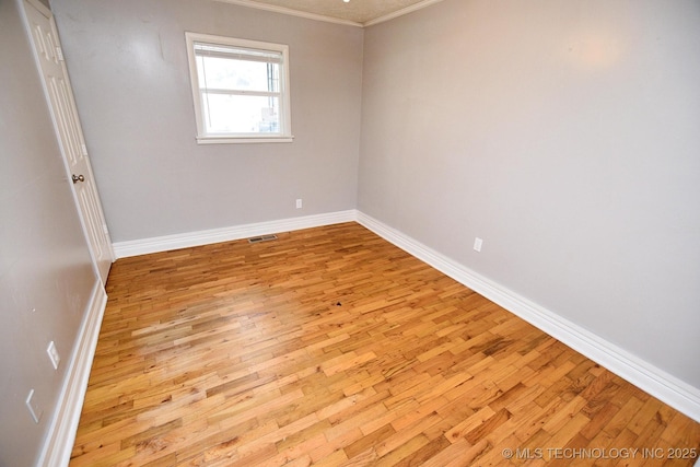 1107 Hillcrest Ave, Tahlequah, OK 74464 - spare room with ornamental molding and light wood-style floors